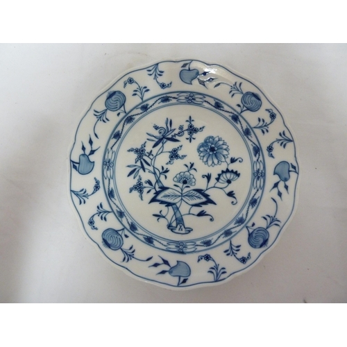 59 - A pair of Meissen porcelain plates, painted in blue with onion pattern, 24.5cm diam approx (2)