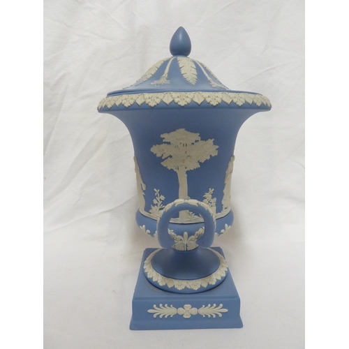 77 - A Wedgwood pale blue jasper urn and cover, the body sprigged with classical maidens over a square pl... 