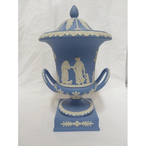 77 - A Wedgwood pale blue jasper urn and cover, the body sprigged with classical maidens over a square pl... 