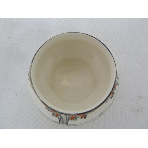 80 - A Crown Ducal Ware Orange Tree pattern preserve pot cover and integral stand; a tea plate fitted wit... 