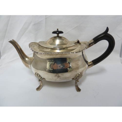 21 - A William Hutton & Sons four piece silver tea set, comprising teapot, milk jug and two handled sugar... 