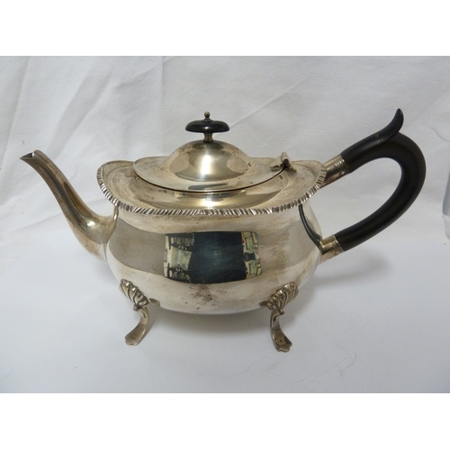 21 - A William Hutton & Sons four piece silver tea set, comprising teapot, milk jug and two handled sugar... 