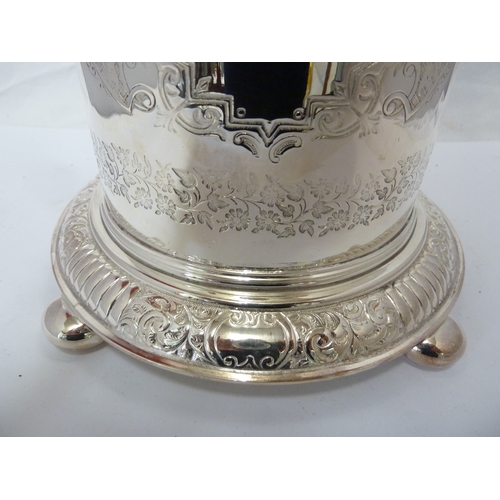 3 - A silver plated biscuit box, circular on bun feet and with hinged cover, decorated with floral garla... 