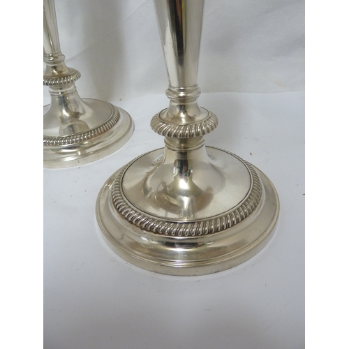 6 - A pair of silver plated twisted arm candelabra, three light, the central sconce with removable flame... 