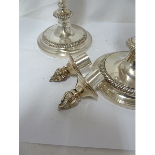 6 - A pair of silver plated twisted arm candelabra, three light, the central sconce with removable flame... 