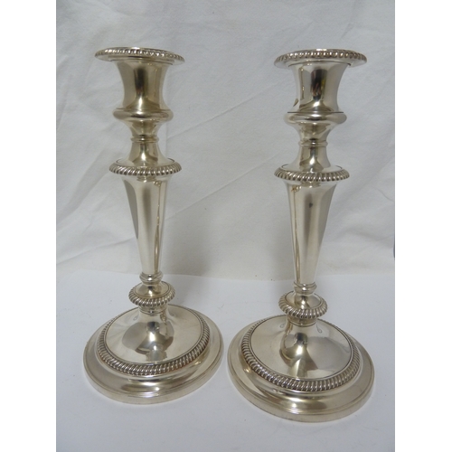 6 - A pair of silver plated twisted arm candelabra, three light, the central sconce with removable flame... 