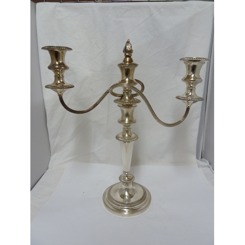 6 - A pair of silver plated twisted arm candelabra, three light, the central sconce with removable flame... 