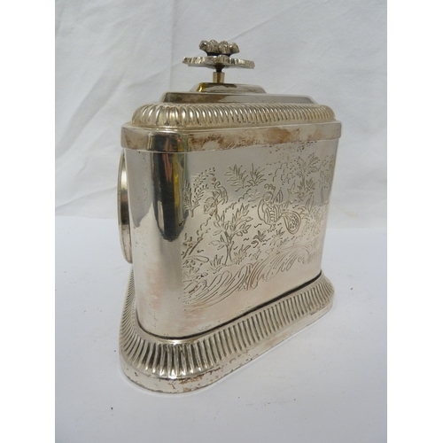 7 - A silver plated triangular box and cover, a clock face set into one side (2)