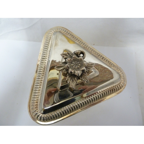 7 - A silver plated triangular box and cover, a clock face set into one side (2)