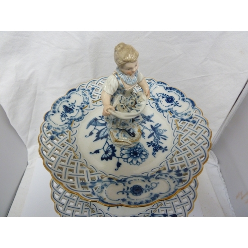 91 - A Meissen two tiered cake stand centerpiece, the tiers decorated with onion pattern within pierced o... 