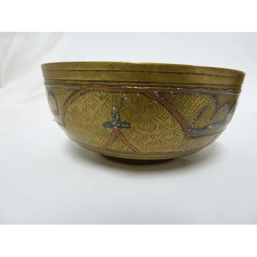 100 - A pair of Indian or Islamic brass temple bowls, richly chased and inlaid in white and copper metals ... 