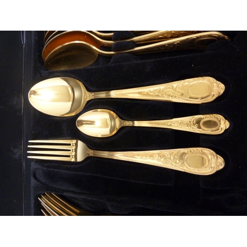 14 - A gold plated cutlery service for 12, comprises: 12 dinner forks; 12 dinner knives; 12 table spoons;... 