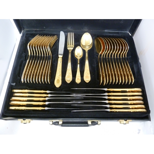 14 - A gold plated cutlery service for 12, comprises: 12 dinner forks; 12 dinner knives; 12 table spoons;... 