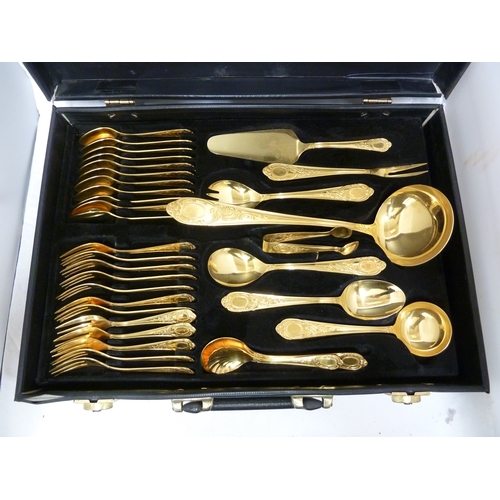 14 - A gold plated cutlery service for 12, comprises: 12 dinner forks; 12 dinner knives; 12 table spoons;... 