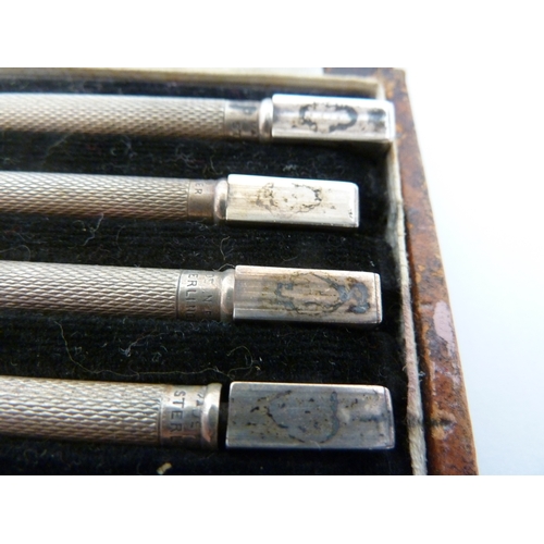 8 - A cased set of silver bridge pencils, marked Made in England and STERLING, in fitted box (5)