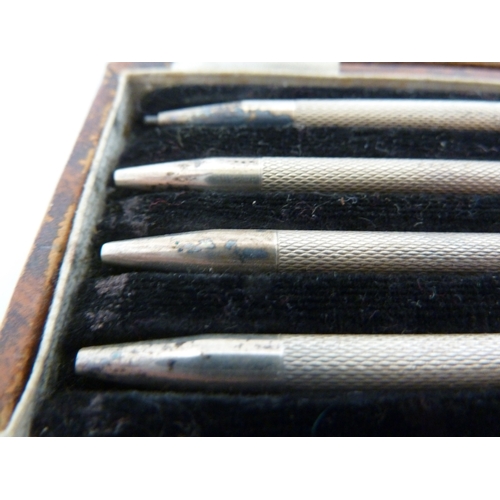 8 - A cased set of silver bridge pencils, marked Made in England and STERLING, in fitted box (5)