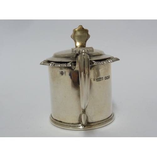 9 - A three piece silver cruet set, comprises pepperette, mustard and salt, the mustard and salt with fi... 