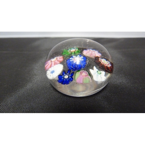 144 - A Clichy miniature glass paperweight, composed of 8 millefiori canes about a central cane, includes ... 