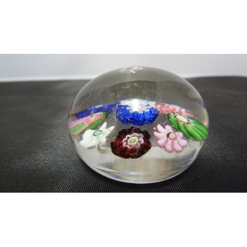 144 - A Clichy miniature glass paperweight, composed of 8 millefiori canes about a central cane, includes ... 