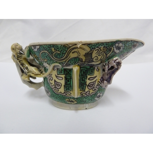 110 - A Chinese porcelain libation cup, decorated in famille verte  with Chilong dragons, after an archais... 