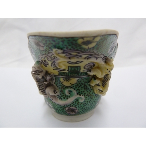 110 - A Chinese porcelain libation cup, decorated in famille verte  with Chilong dragons, after an archais... 