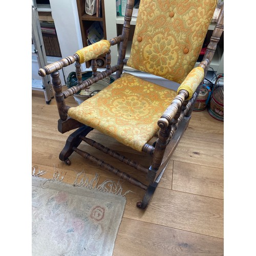 134 - A bobbin turned rocking chair, 106 cm high x 56 cm wide x 70cm max depth