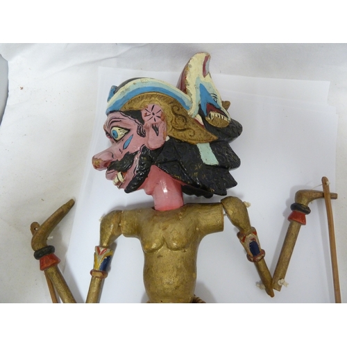 133 - An Indonesian Wayang Golek (rod puppet) figure of a man; and a large mask with rotating eyes (2)