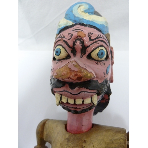 133 - An Indonesian Wayang Golek (rod puppet) figure of a man; and a large mask with rotating eyes (2)