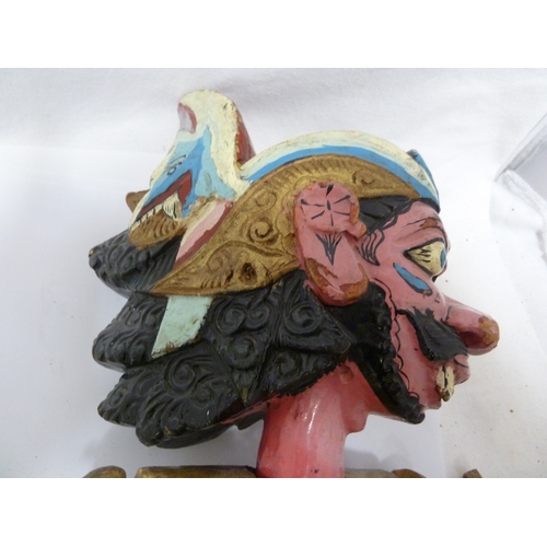 133 - An Indonesian Wayang Golek (rod puppet) figure of a man; and a large mask with rotating eyes (2)