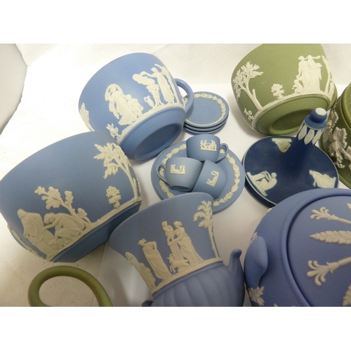 119 - A group of Wedgwood Jasper wares, comprising: a circular sugar box and cover, eight teacups, an urn ... 