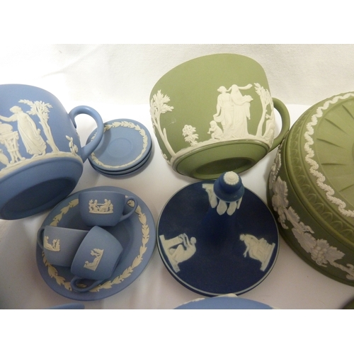 119 - A group of Wedgwood Jasper wares, comprising: a circular sugar box and cover, eight teacups, an urn ... 