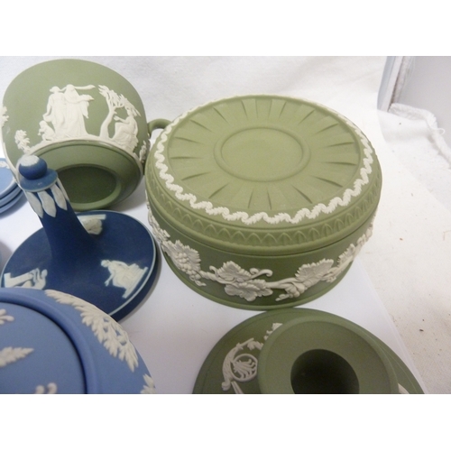 119 - A group of Wedgwood Jasper wares, comprising: a circular sugar box and cover, eight teacups, an urn ... 