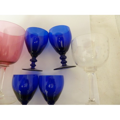 116 - Various glass wares; four Bristol blue rummers; two cranberry; six cut glass ports; and other glassw... 