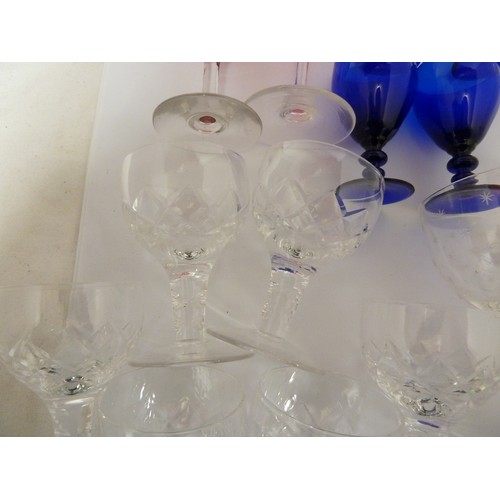 116 - Various glass wares; four Bristol blue rummers; two cranberry; six cut glass ports; and other glassw... 