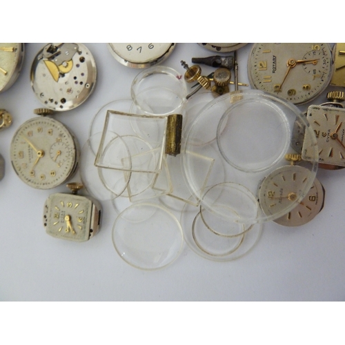 24 - A restorers box of watch parts, invcludinga movements/dials marked Garrard, Longines, Tissot etc; an... 