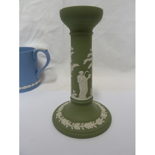 136 - A group of Wedgwood jasper wares, comprising: a two handled loving cup, a jug, a candlestick, a part... 