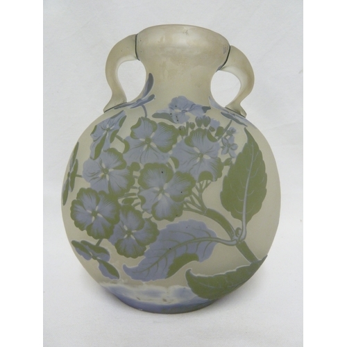 33 - Galle - a large three colour glass vase, of moon flask shape with handles cut with flowers, 21.5 cm ... 