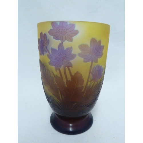 34 - Galle - a cameo glass vase decorated with blue flowers on a yellow ground, 15cm high.