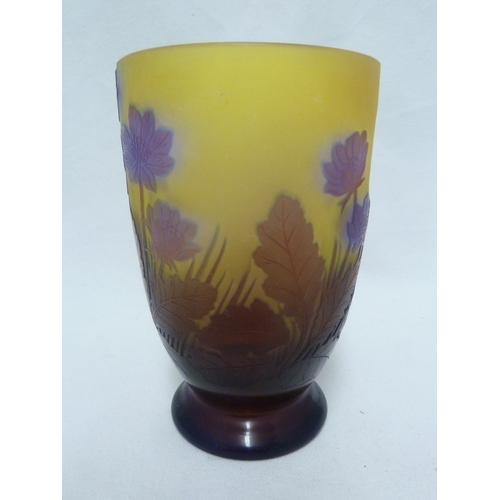 34 - Galle - a cameo glass vase decorated with blue flowers on a yellow ground, 15cm high.