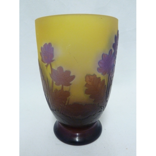 34 - Galle - a cameo glass vase decorated with blue flowers on a yellow ground, 15cm high.