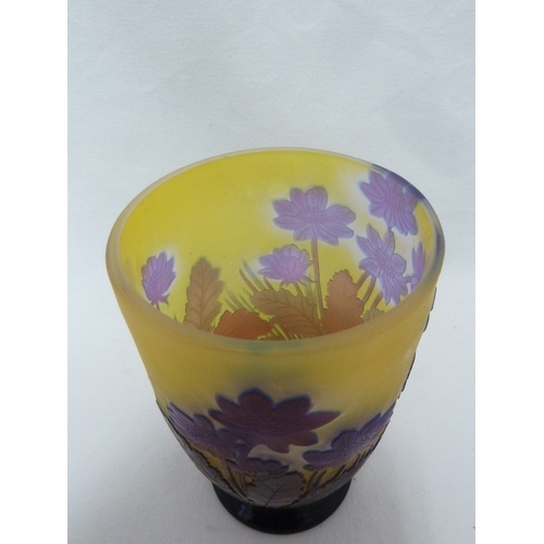 34 - Galle - a cameo glass vase decorated with blue flowers on a yellow ground, 15cm high.