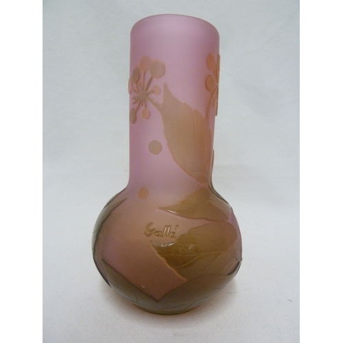 35 - Galle - A cameo glass vase, decorated with green flowers on a pink opalescent ground, 15cm high