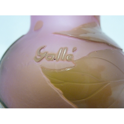 35 - Galle - A cameo glass vase, decorated with green flowers on a pink opalescent ground, 15cm high