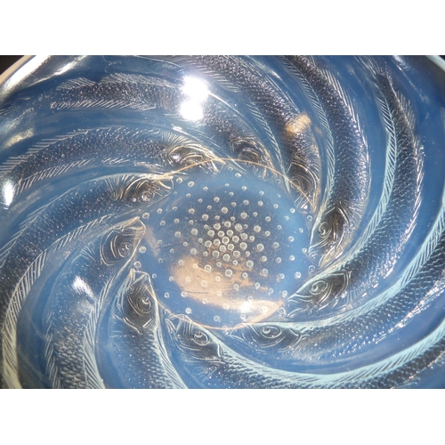 41 - R. Lalique - a Poissons opalescent glass bowl, the fish arranged in a spiral about a central base of... 