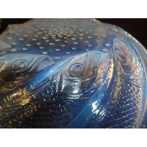 41 - R. Lalique - a Poissons opalescent glass bowl, the fish arranged in a spiral about a central base of... 