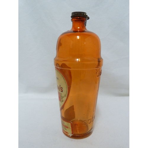 189 - A Gordon's Piccadilly Cocktail shaker, of orange glass, original paper labels and cover, 24cm high