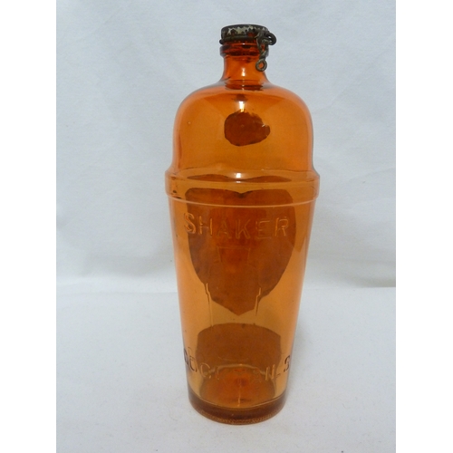 189 - A Gordon's Piccadilly Cocktail shaker, of orange glass, original paper labels and cover, 24cm high