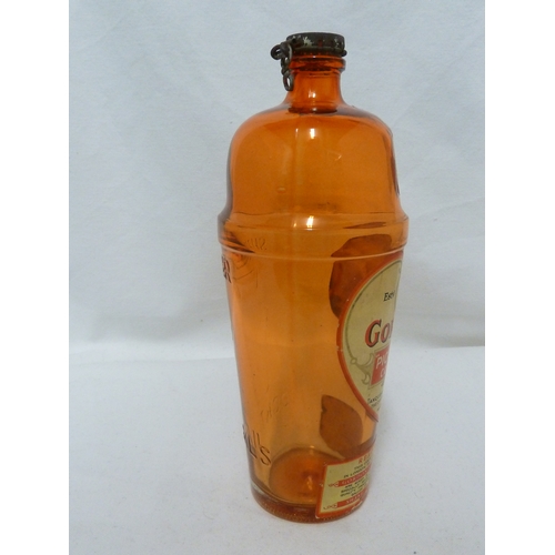 189 - A Gordon's Piccadilly Cocktail shaker, of orange glass, original paper labels and cover, 24cm high