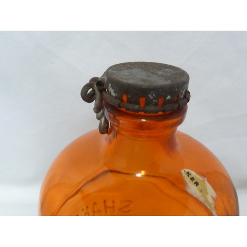 189 - A Gordon's Piccadilly Cocktail shaker, of orange glass, original paper labels and cover, 24cm high