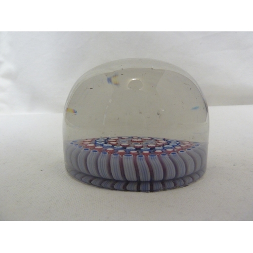 27 - An old English magnum glass paperweight, of red,white and blue concentric canes, 9 cm diam approx.